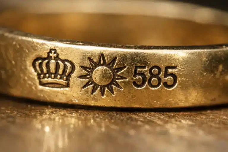 German crown and sun hallmark with 585 fineness mark on gold jewelry showing official quality stamp risultato