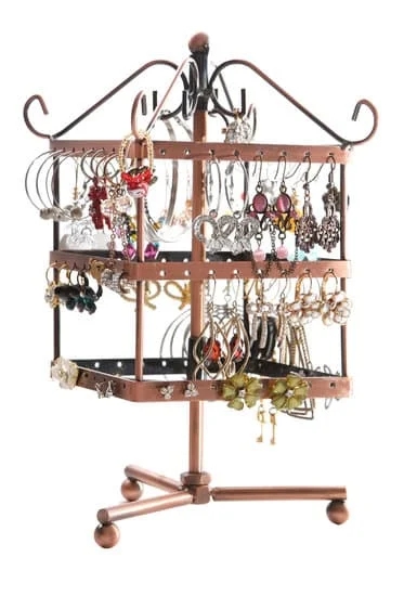 Sapphire, ruby, and emerald gemstones in a ring on a hand - How to identify gemstones in jewelry