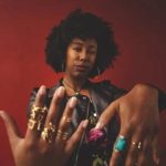 A Jewelry Maker Has 24 Jade Beads Jewelry maker stringing 24 jade beads onto a necklace, creating beautiful handcrafted accessories