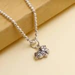 Variety of tools to make beaded jewelry like pliers, wire cutters, bead mats, and storage containers