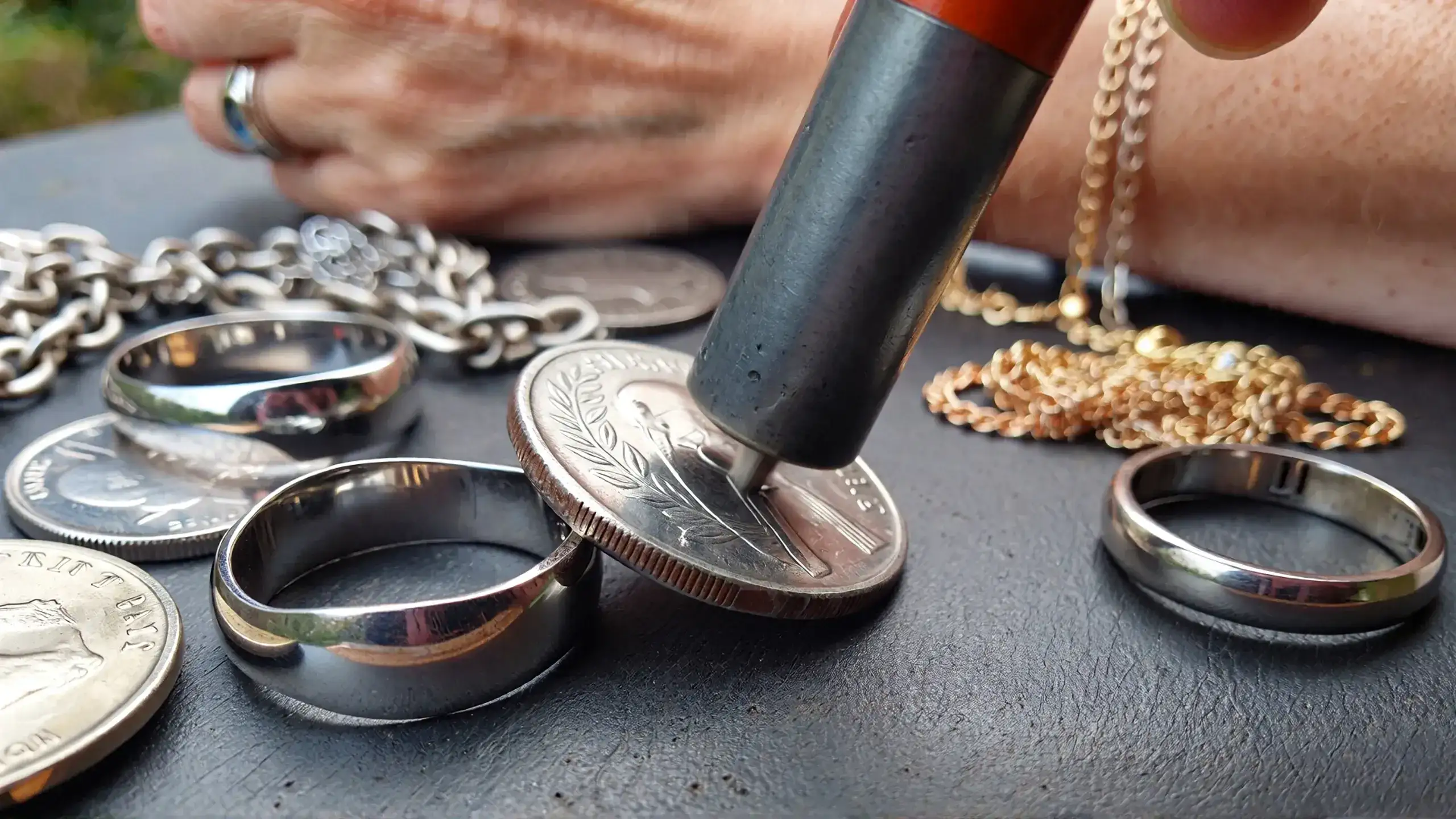 Neodymium magnet sliding slowly down tilted silver coin demonstrating diamagnetic properties of sterling silver_risultato