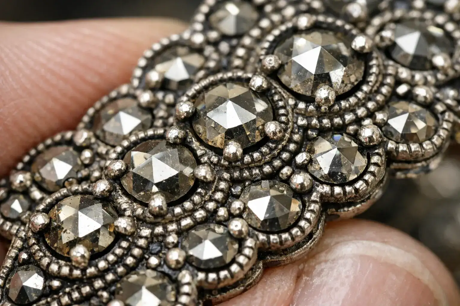 What Happened To Judith Jack Jewelry Close-up of hand-set marcasite stones in Judith Jack jewelry showing faceted cuts that create diamond-like sparkle_risultato