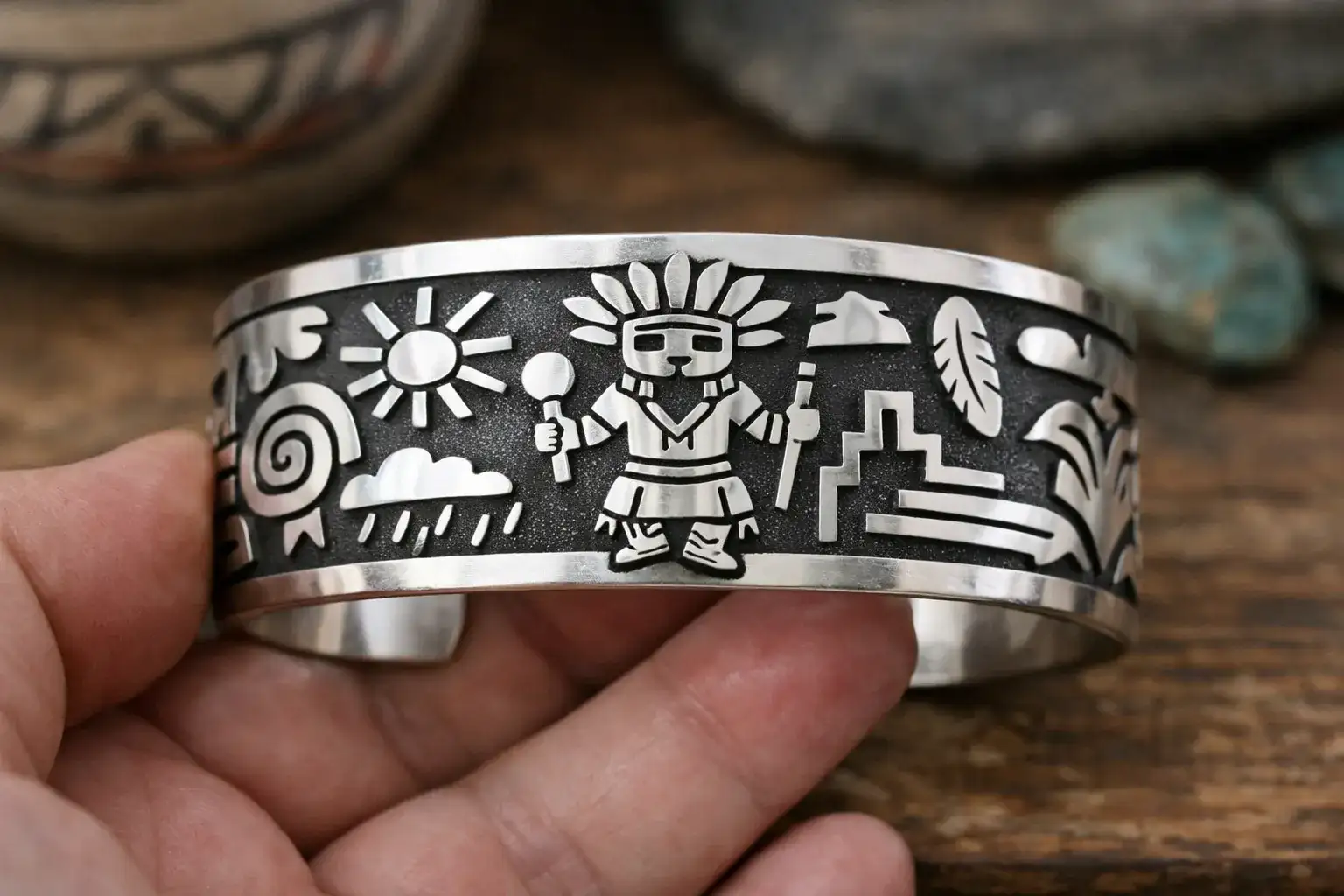 Hopi overlay silver cuff bracelet featuring traditional kachina design with oxidized background and polished silver top layer_risultato